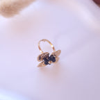 bague acier inoxydable femme forme fleur perles noires